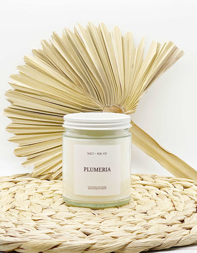 Luxury plumeria scented candles for sale at salt and SOL co candle business